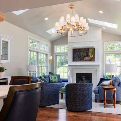 Family room addition; sunlights; vaulted ceiling; green, blue, white with gold chandelier Wilcox Architecture