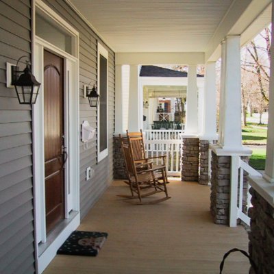 Front porch with stone piers and wood columns