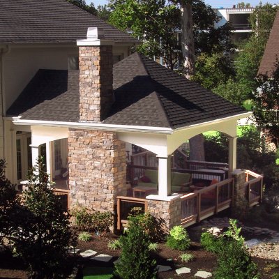 Covered patio with stone chimney