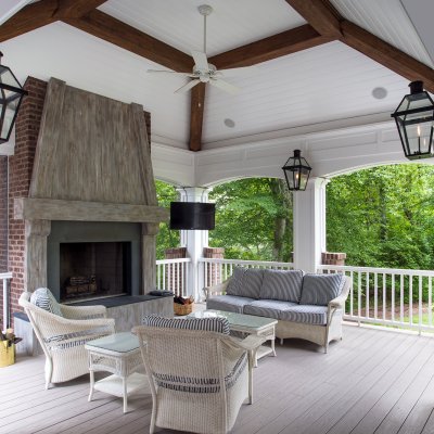 Outdoor Living addition with fireplace, couches,  gas lights, and ceiling fan  