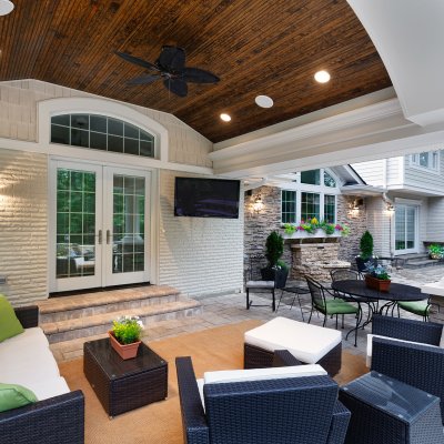 Covered Patio with barreled bead-board ceiling and cozy outdoor seating