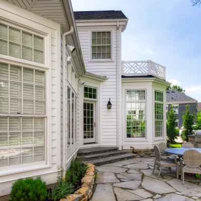 exterior side view of Hyde Park addition and stone patio Wilcox Architecture