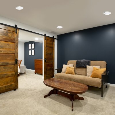 Basement renovation with sliding wood doors  