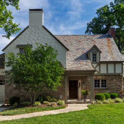 covered front porch addition East Hyde Park Tudor residential architecture Tom Wilcox