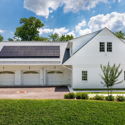 5-car residential garage with solar panels, side entrance