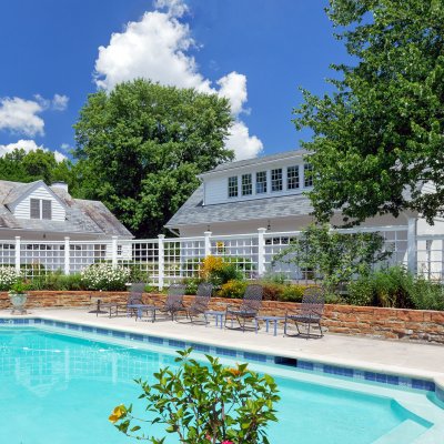 Pool on site next to new and original garages