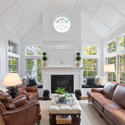 Addition interior view of fireplace, TV cabinet, vaulted tray ceiling