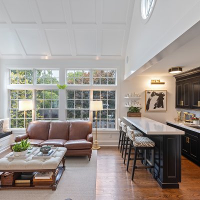 addition large windows vaulted tray ceiling wet bar