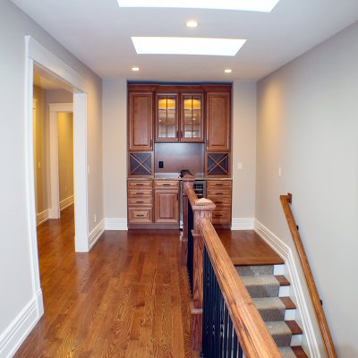 top floor stairs with sky lights