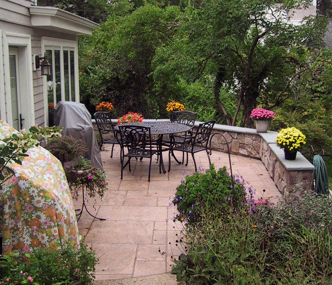 Patio addition with pavers and stone wall in Wyoming